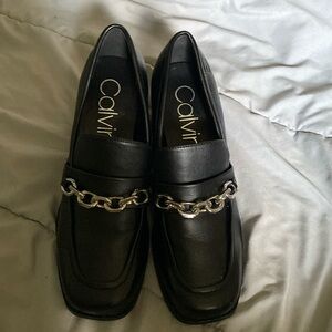 Calvin Klein black women venty loafers.